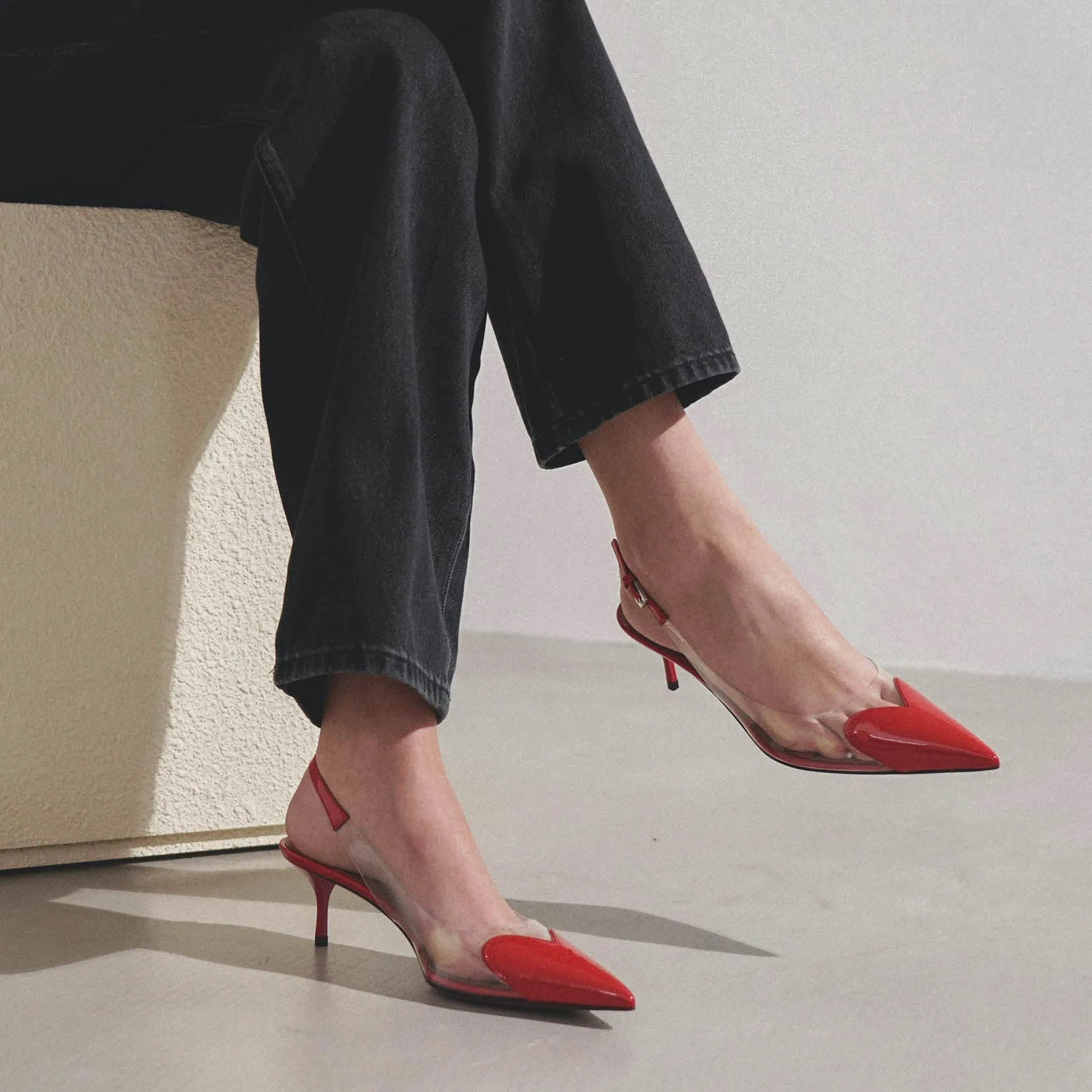 Coeur 55 red patent slingback pumps