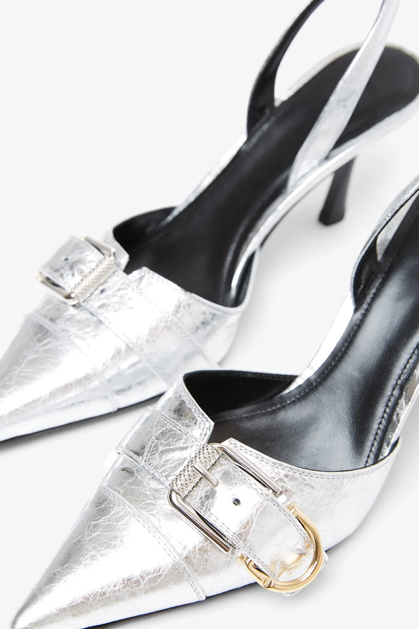 Voyou silver slingback pumps